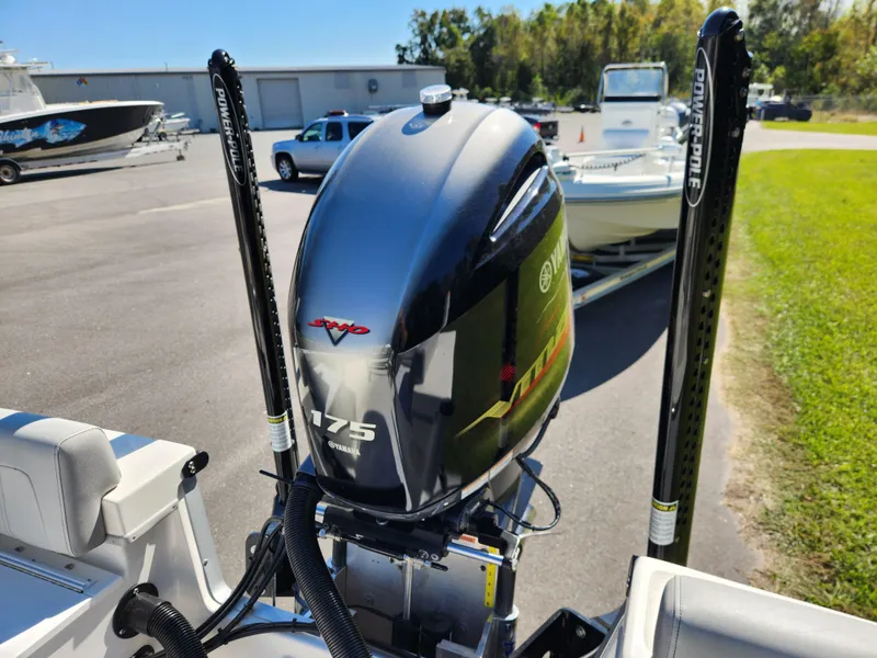 Slide: The Image of 2023 May-Craft 208 CC boat with Yamaha 175 engine in a marina setting. - 21