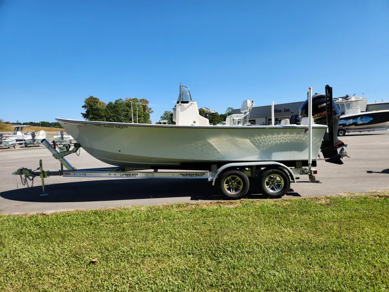 Slide: The Image of 2023 May-Craft 208 CC boat on trailer in sunny outdoor setting. - 6