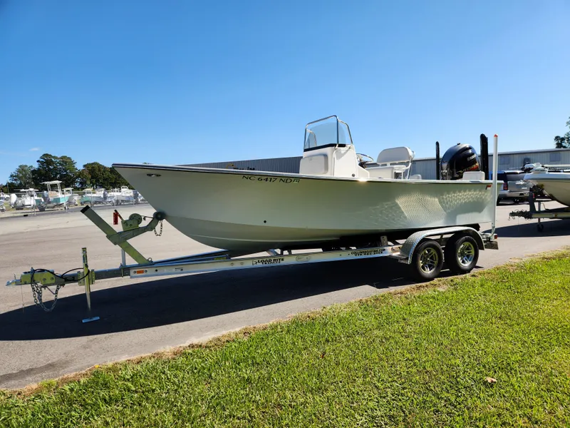 Slide: The Image of 2023 May-Craft 208 CC boat on trailer, parked outdoors on sunny day. - 7
