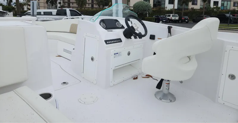 Slide: The Image of 2025 SouthWind 200 SD boat interior with steering wheel and seating. - 2