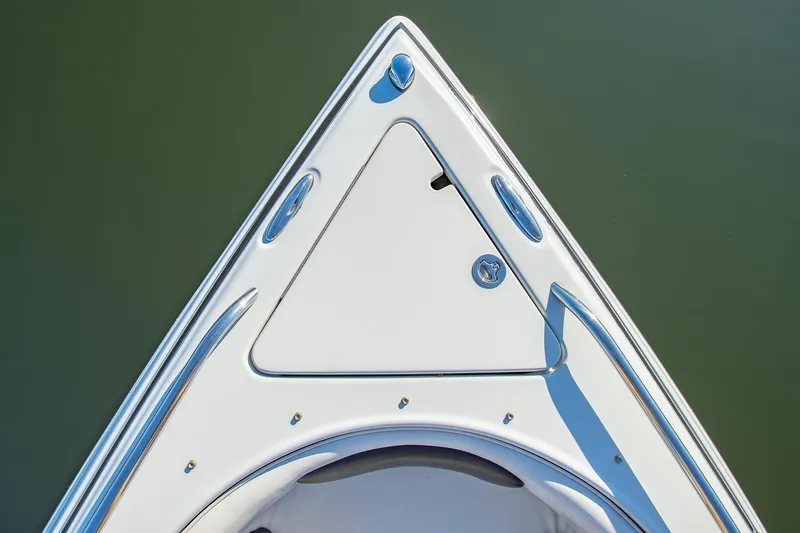 Slide: The Image of Bow of 2006 Crownline 270 BR boat on calm water. - 14