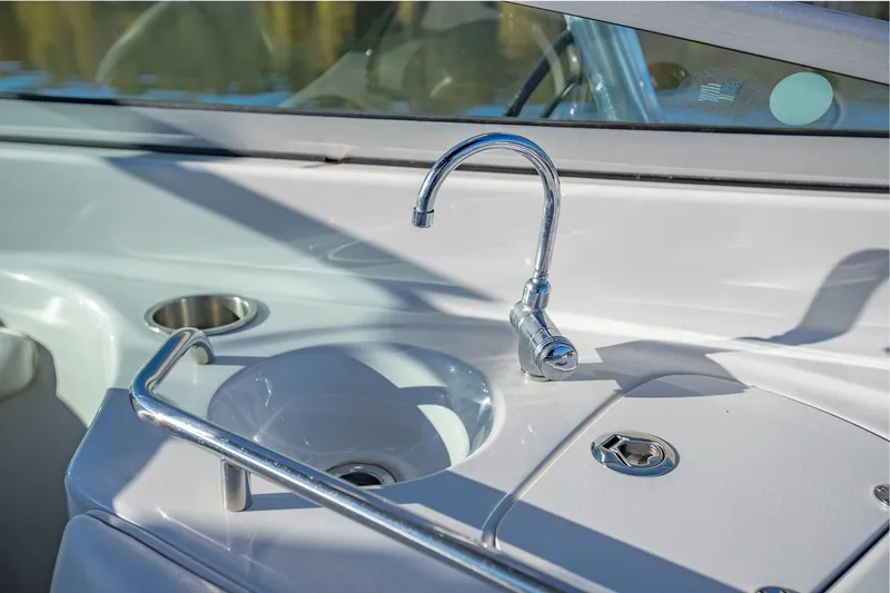 Slide: The Image of 2006 Crownline 270 BR boat sink and faucet detail. - 19