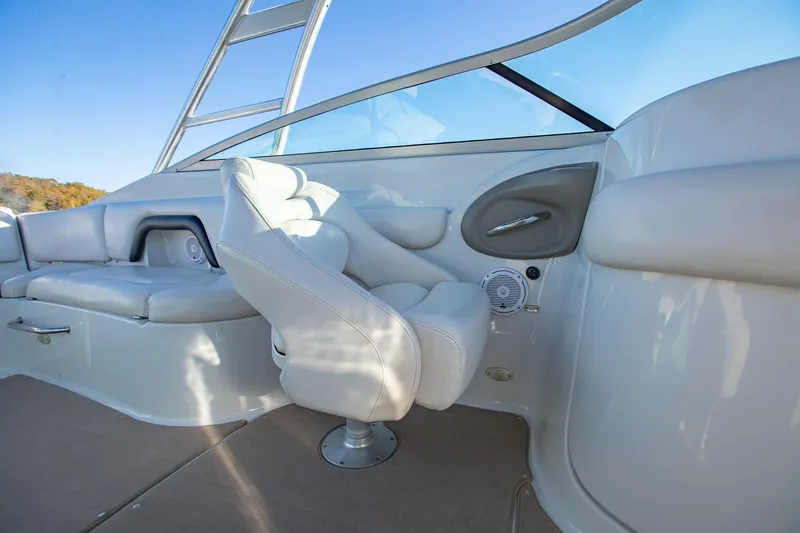 Slide: The Image of Interior of 2006 Crownline 270 BR boat with white seating and sleek design. - 23