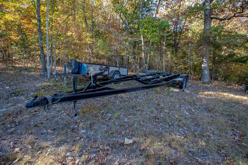 Slide: The Image of 2006 Crownline 270 BR boat trailer in wooded area during autumn. - 36