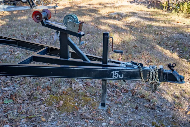 Slide: The Image of Trailer hitch for 2006 Crownline 270 BR boat on grassy ground. - 39