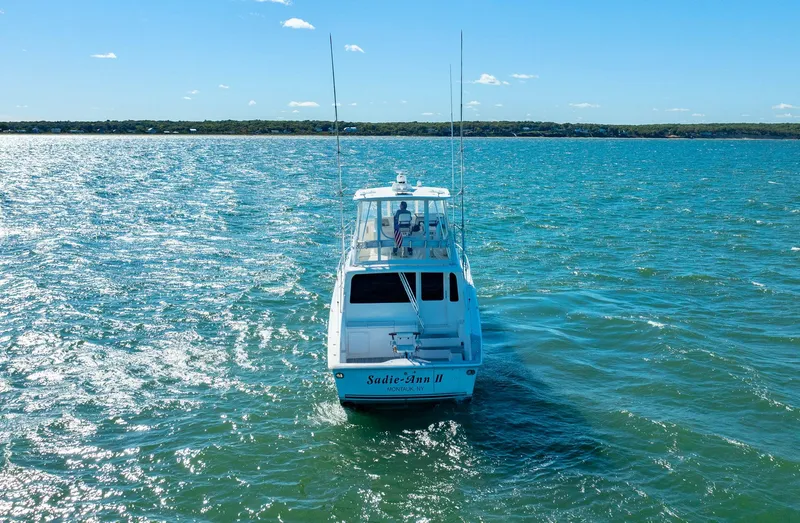 Slide: The Image of 2005 Ocean Yachts 50 Super Sport on open water under clear blue sky. - 1