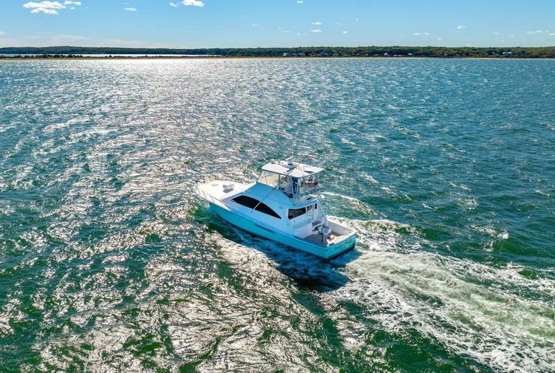 Slide: The Image of 2005 Ocean Yachts 50 Super Sport cruising on a sunny day. - 11