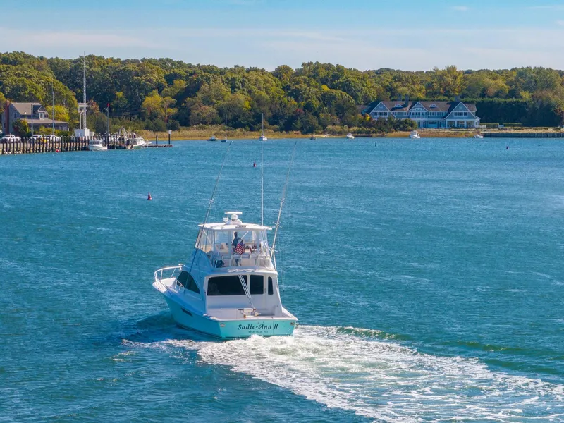 Slide: The Image of 2005 Ocean Yachts 50 Super Sport cruising on a scenic waterway. - 15