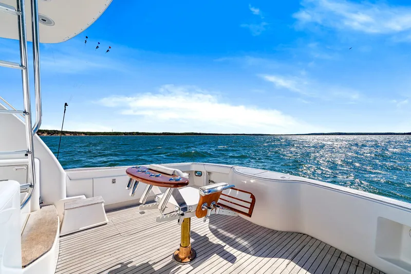 Slide: The Image of 2005 Ocean Yachts 50 Super Sport on open water, sunny day, spacious deck. - 19