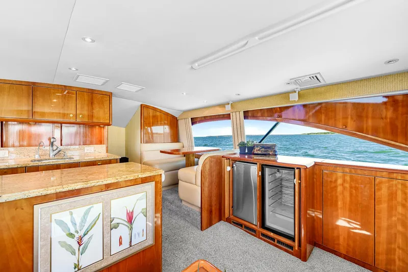 Slide: The Image of Luxurious interior of 2005 Ocean Yachts 50 Super Sport with elegant wood finishes and ocean view. - 27