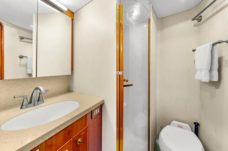 Slide: The Image of Luxurious bathroom in 2005 Ocean Yachts 50 Super Sport, featuring modern fixtures and elegant design. - 33