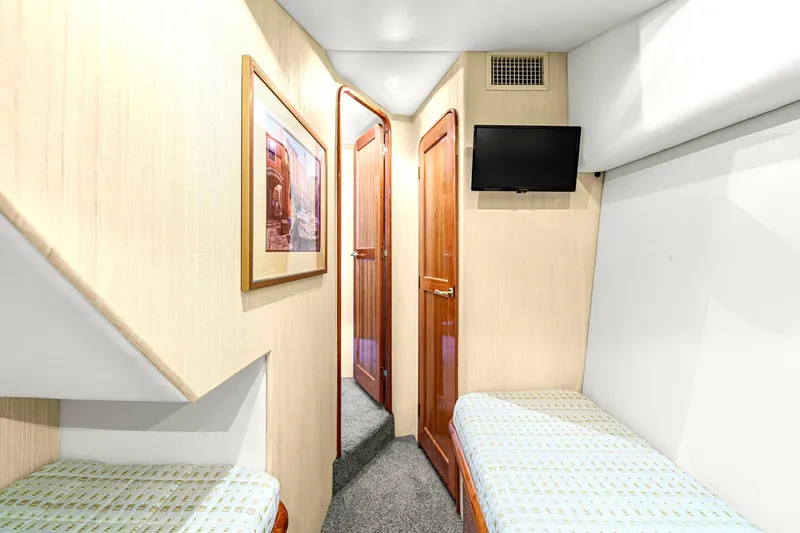 Slide: The Image of Interior cabin of 2005 Ocean Yachts 50 Super Sport with twin beds and TV. - 36