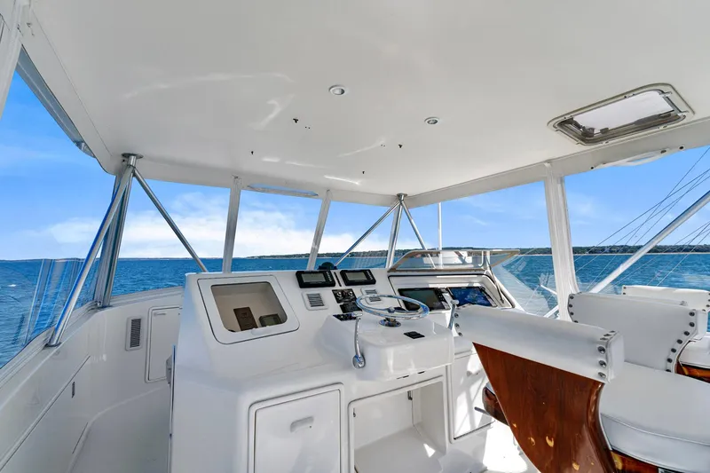 Slide: The Image of 2005 Ocean Yachts 50 Super Sport helm with ocean view, featuring modern navigation equipment. - 37