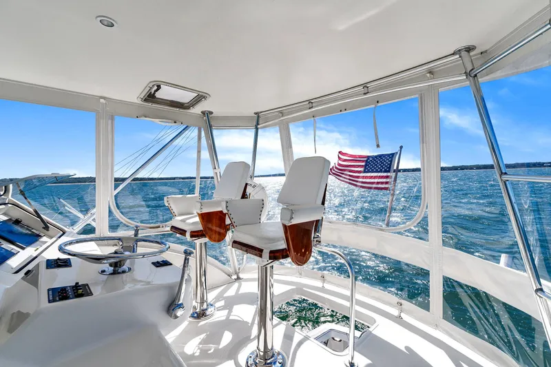 Slide: The Image of Interior view of 2005 Ocean Yachts 50 Super Sport with ocean backdrop and American flag. - 39