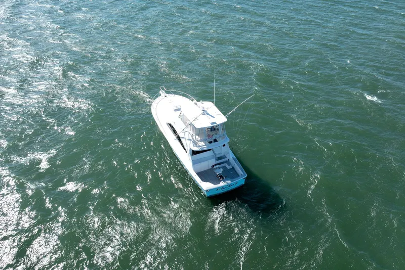 Slide: The Image of 2005 Ocean Yachts 50 Super Sport cruising on open water. - 4