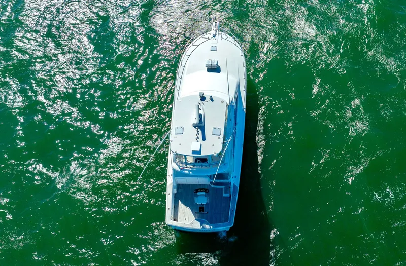 Slide: The Image of Aerial view of 2005 Ocean Yachts 50 Super Sport on green water. - 9