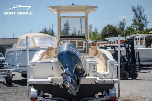 Slide: The Image of 2023 Scout 215 XSF boat with outboard motor on trailer. - 4