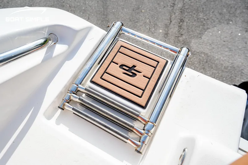 Slide: The Image of 2024 Sea Pro 239 Deep V CC boat ladder with logo on deck. - 16