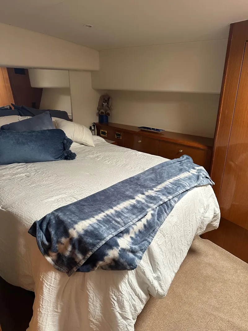 Slide: The Image of 1999 Viking 55 Convertible yacht kitchen with wood cabinets and modern appliances. - 17