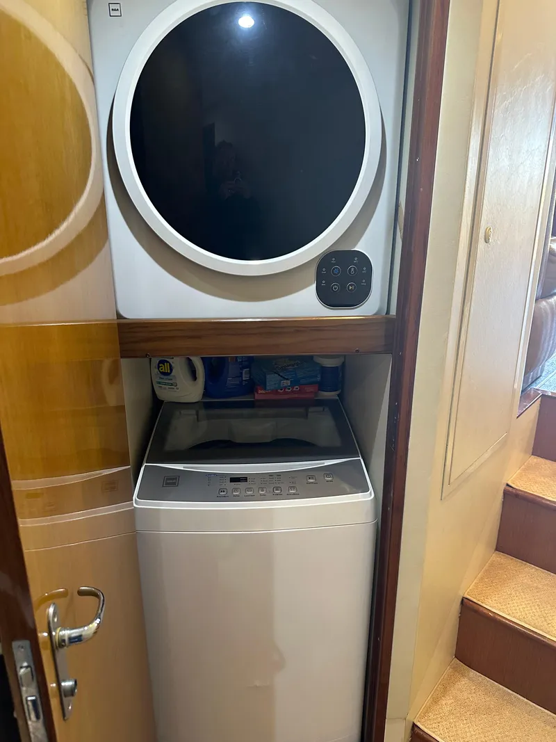 Slide: The Image of Stacked washer and dryer in 1999 Viking 55 Convertible yacht interior. - 19