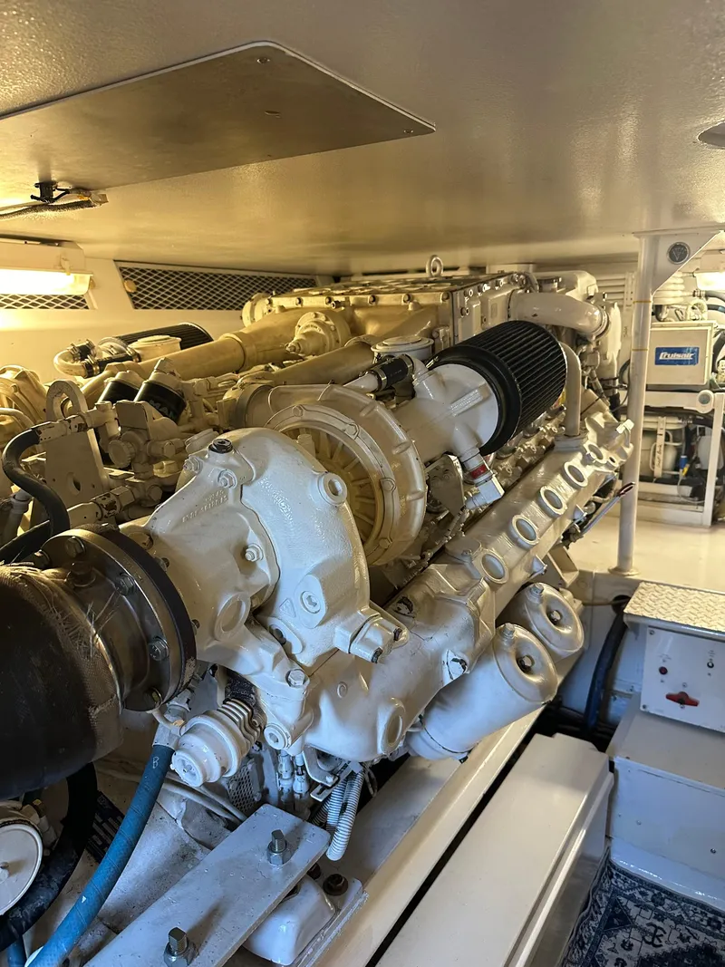 Slide: The Image of Engine room of 1999 Viking 55 Convertible yacht, showcasing powerful machinery. - 21