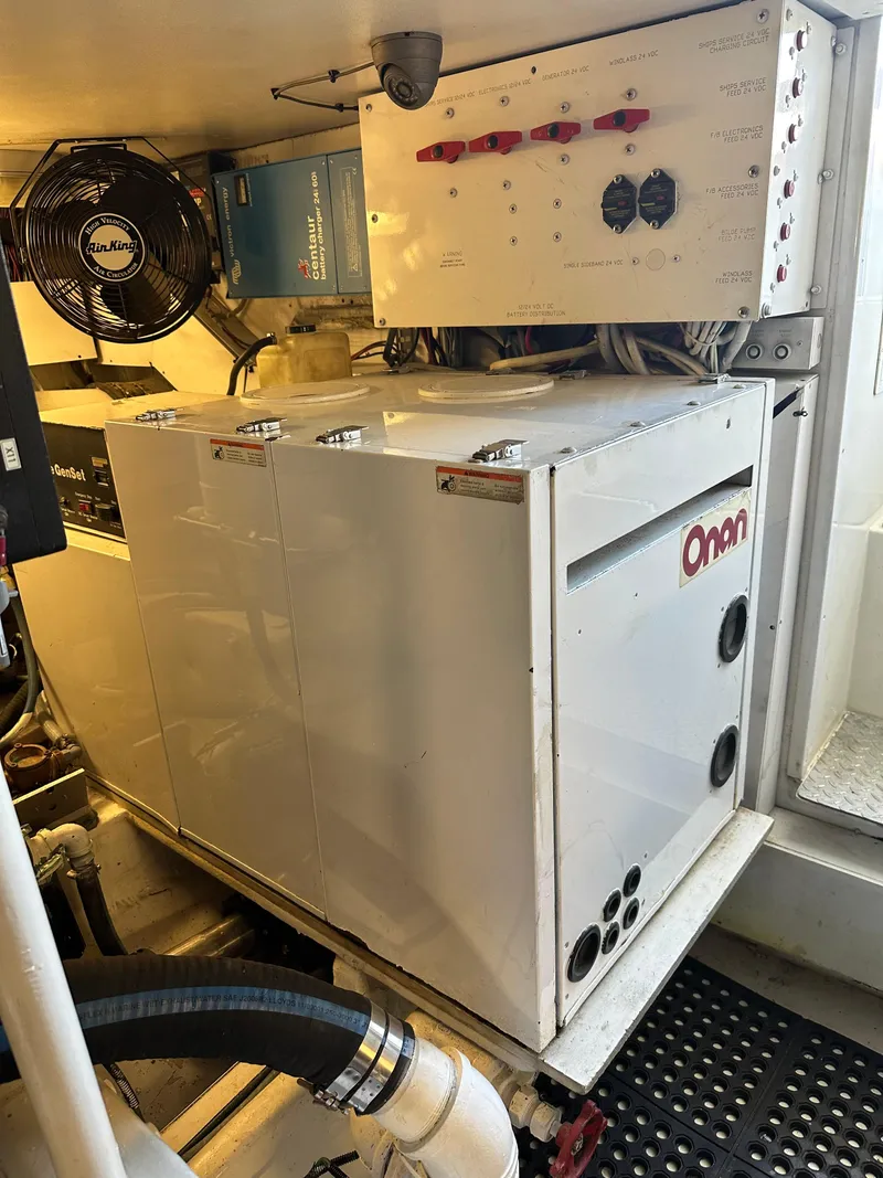 Slide: The Image of Engine room of 1999 Viking 55 Convertible with Onan generator and control panel. - 25