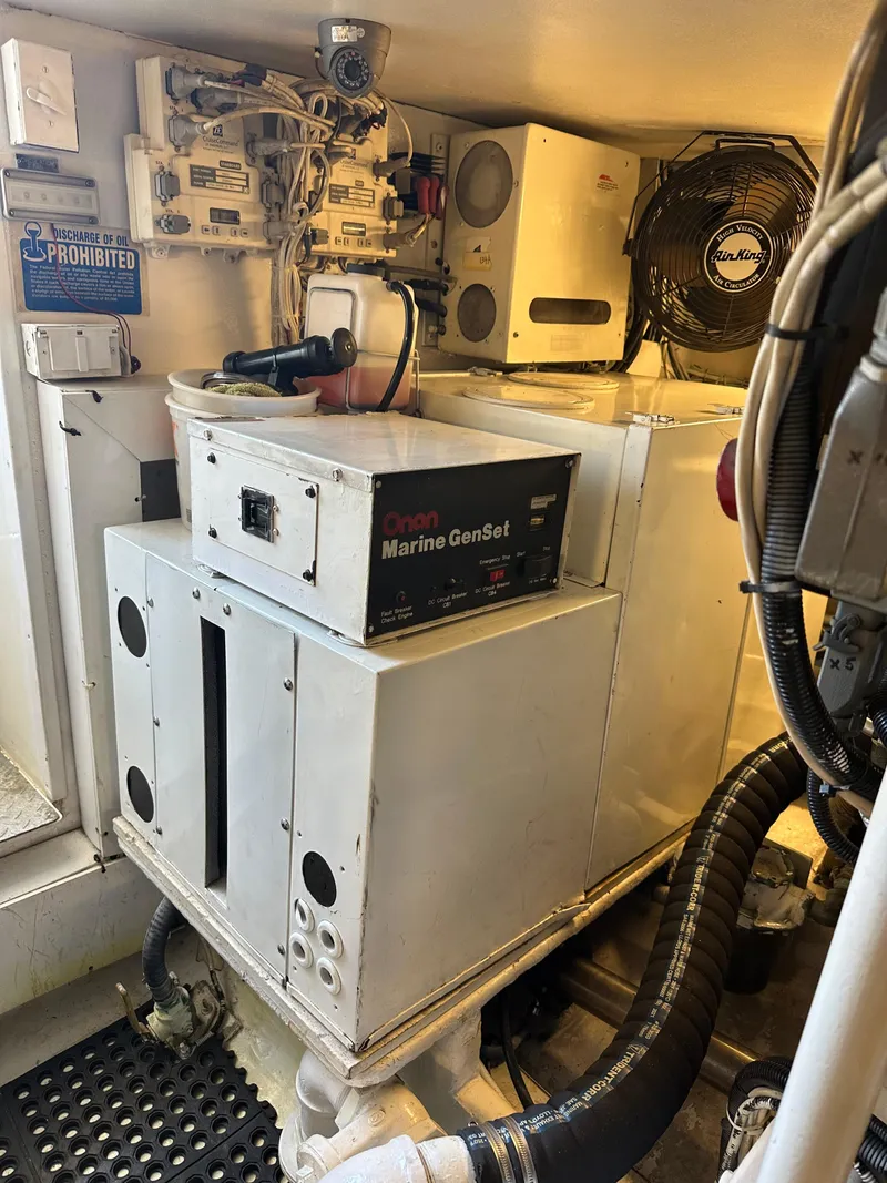 Slide: The Image of Engine room of 1999 Viking 55 Convertible with Onan Marine GenSet. - 26