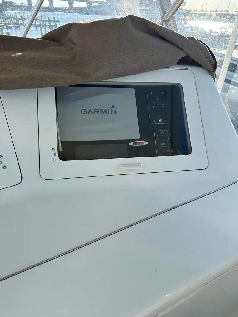 Slide: The Image of Garmin navigation system on 1999 Viking 55 Convertible yacht dashboard. - 29
