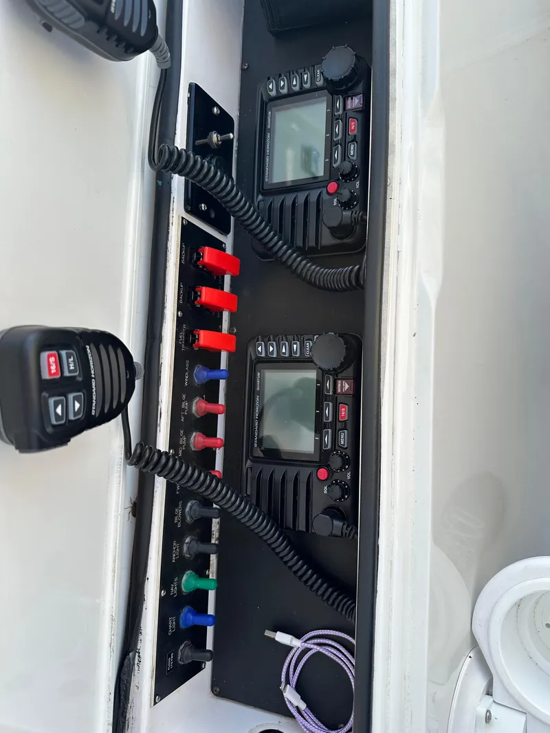 Slide: The Image of Viking 55 Convertible 1999 boat radio and control panel with microphones. - 32
