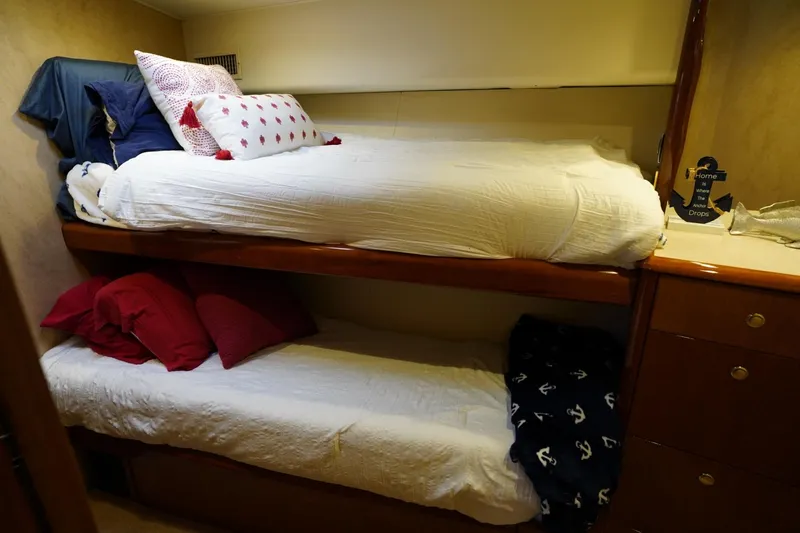 Slide: The Image of Bunk beds in 1999 Viking 55 Convertible yacht cabin with nautical decor. - 39