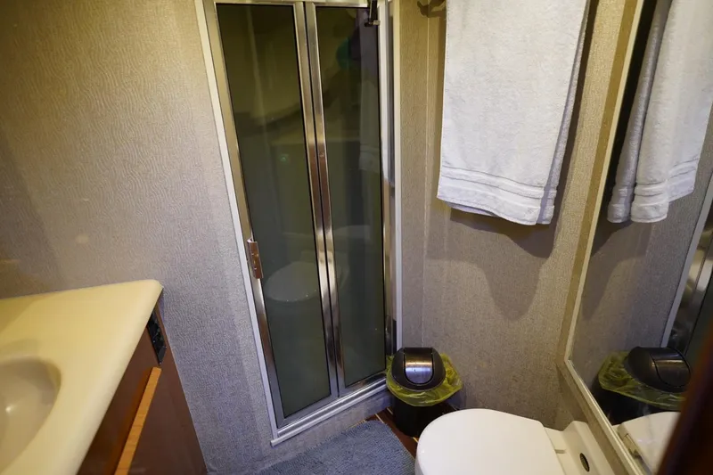 Slide: The Image of Bathroom interior of 1999 Viking 55 Convertible yacht with shower and toilet. - 45