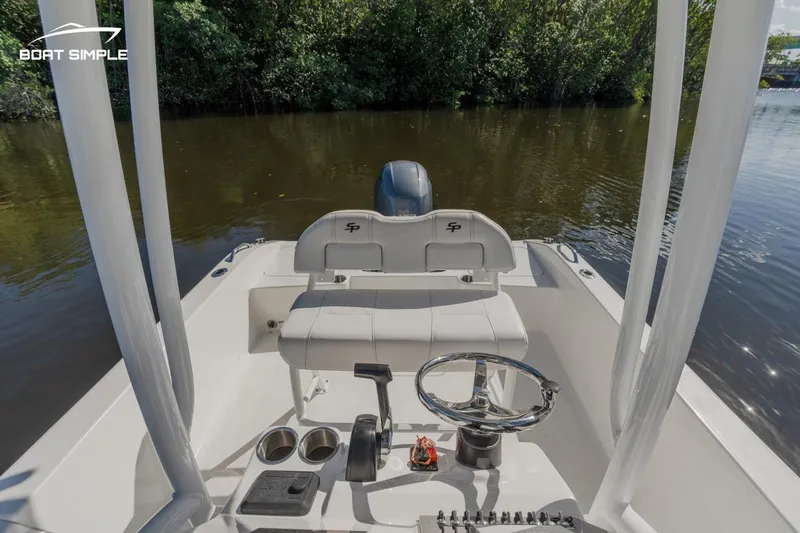 Slide: The Image of 2023 Sea Pro 199 Deep V Center Console boat interior with steering wheel and seating. - 8