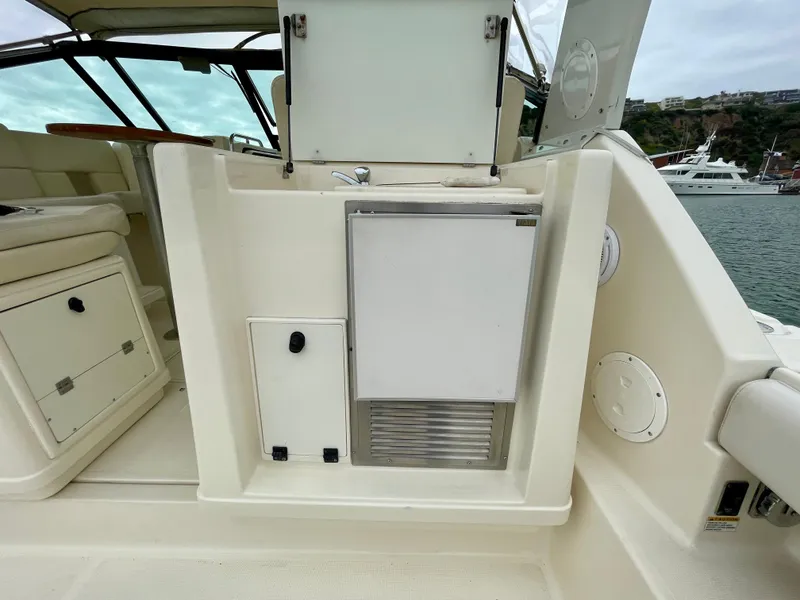 Slide: The Image of 1998 Tiara Yachts 3100 Open interior with storage compartments and seating area. - 25