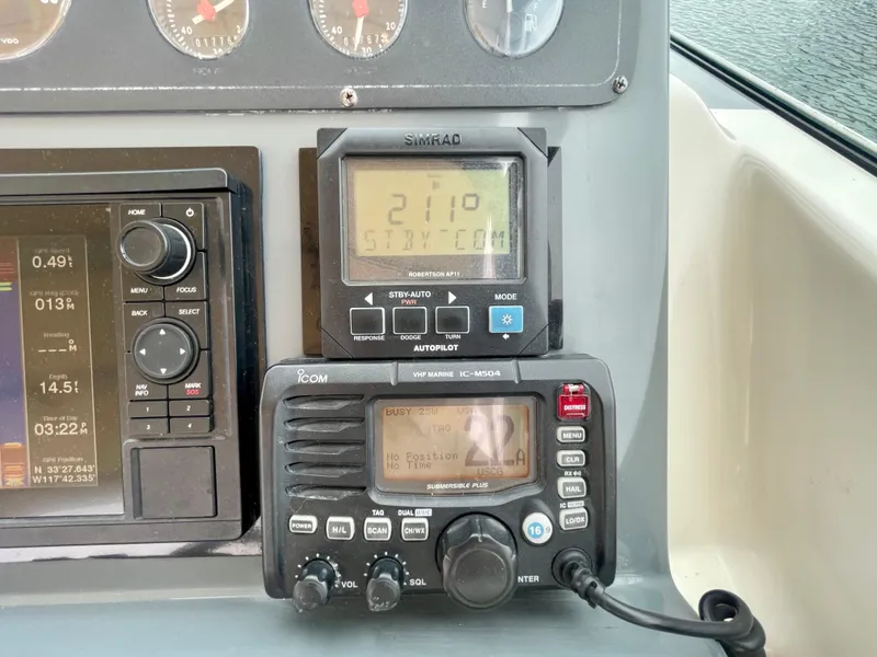 Slide: The Image of Control panel of a 1998 Tiara Yachts 3100 Open with navigation instruments. - 36