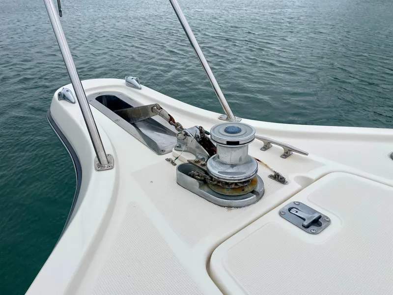 Slide: The Image of Tiara Yachts 3100 Open 1998 bow with anchor winch on calm water. - 39