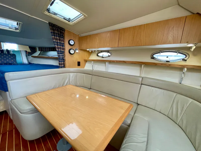Slide: The Image of Interior of 1998 Tiara Yachts 3100 Open with seating and table. - 45