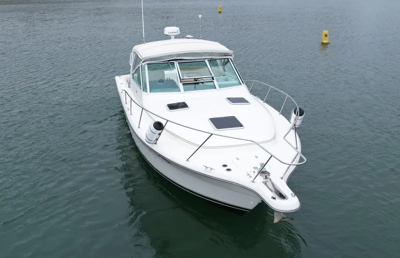 Slide: The Image of 1998 Tiara Yachts 3100 Open boat on calm water. - 7