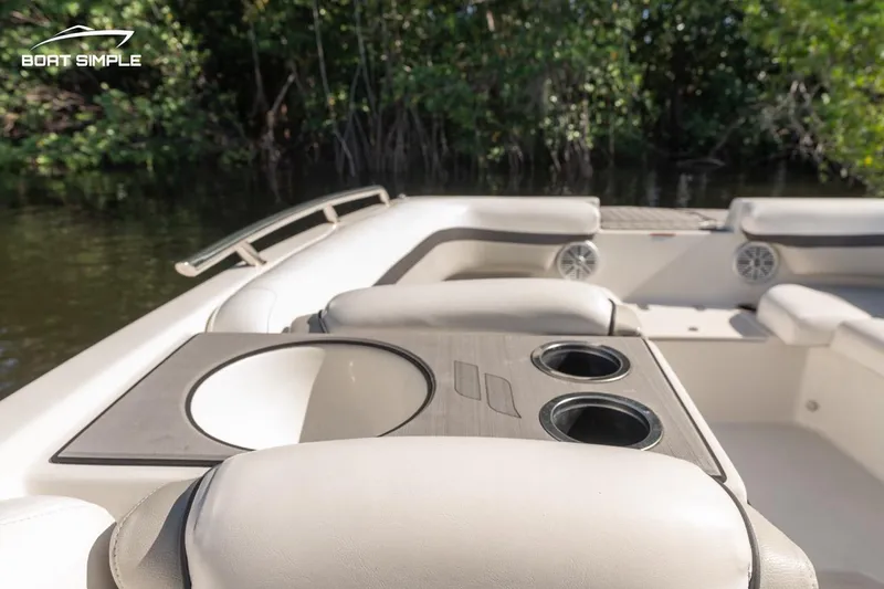 Slide: The Image of 2023 Starcraft SVX 211 OB boat interior with seating and cup holders. - 10