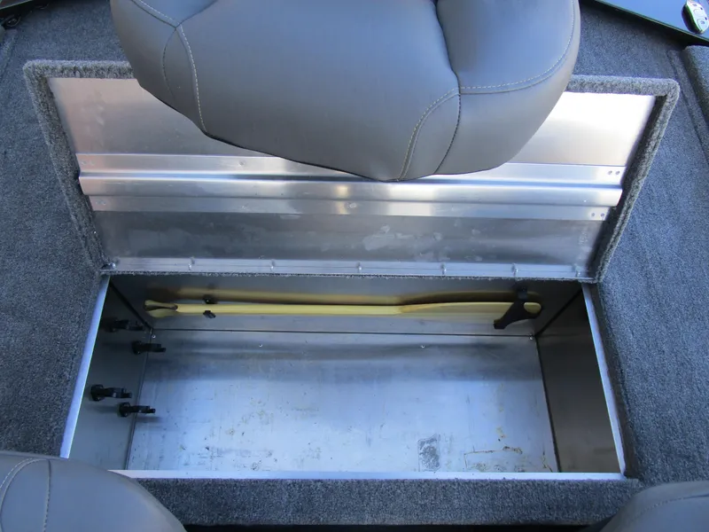 Slide: The Image of 2023 Tracker Bass Tracker Classic XL storage compartment with open lid and seating. - 14