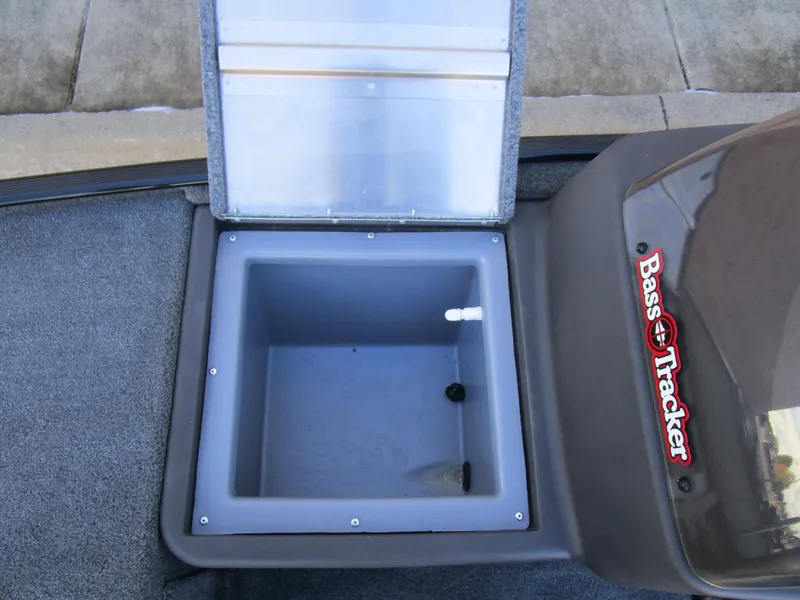Slide: The Image of 2023 Tracker Bass Tracker Classic XL livewell compartment, open lid, gray interior. - 15