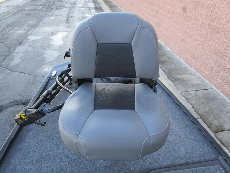 Slide: The Image of 2023 Tracker Bass Tracker Classic XL boat seat, gray upholstery, on a textured deck. - 17