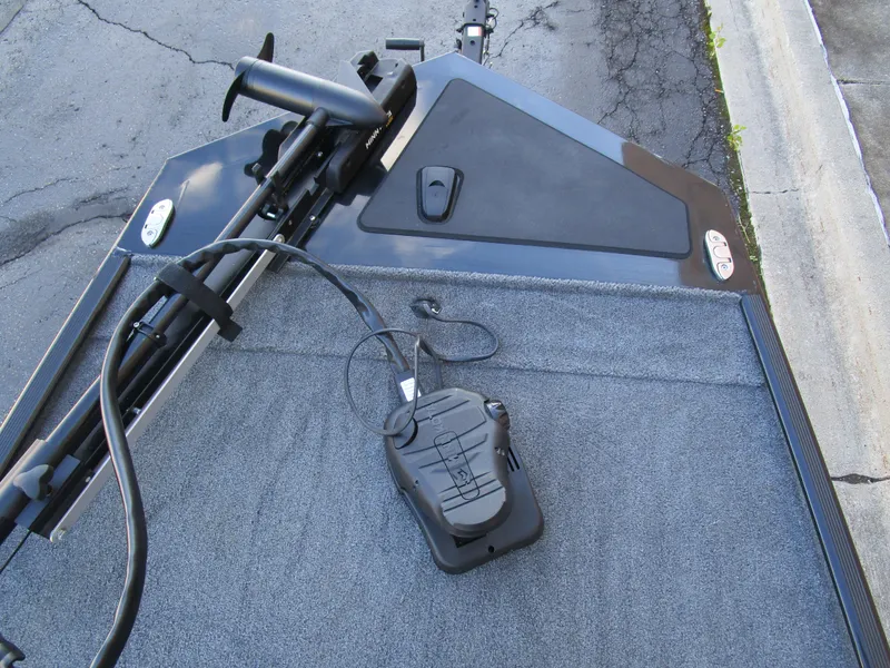 Slide: The Image of 2023 Tracker Bass Tracker Classic XL boat deck with trolling motor and foot pedal. - 18