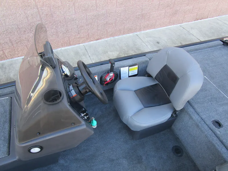 Slide: The Image of 2023 Tracker Bass Tracker Classic XL boat interior with steering console and seat. - 19