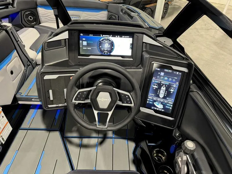 Slide: The Image of 2025 Supra SA boat dashboard with advanced digital displays and modern steering wheel design. - 12
