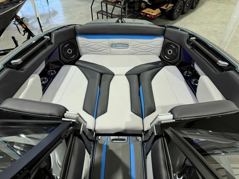 Slide: The Image of 2025 Supra SA boat interior with modern seating and audio system. - 13