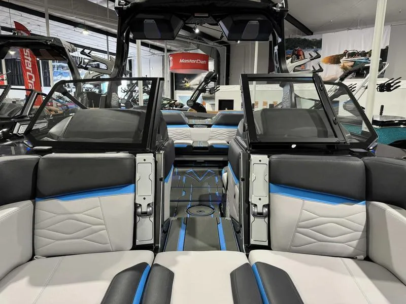 Slide: The Image of Interior of 2025 Supra SA boat with modern seating and sleek design. - 14
