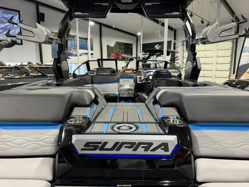 Slide: The Image of 2025 Supra SA boat interior with modern design, featuring sleek seating and advanced technology. - 8