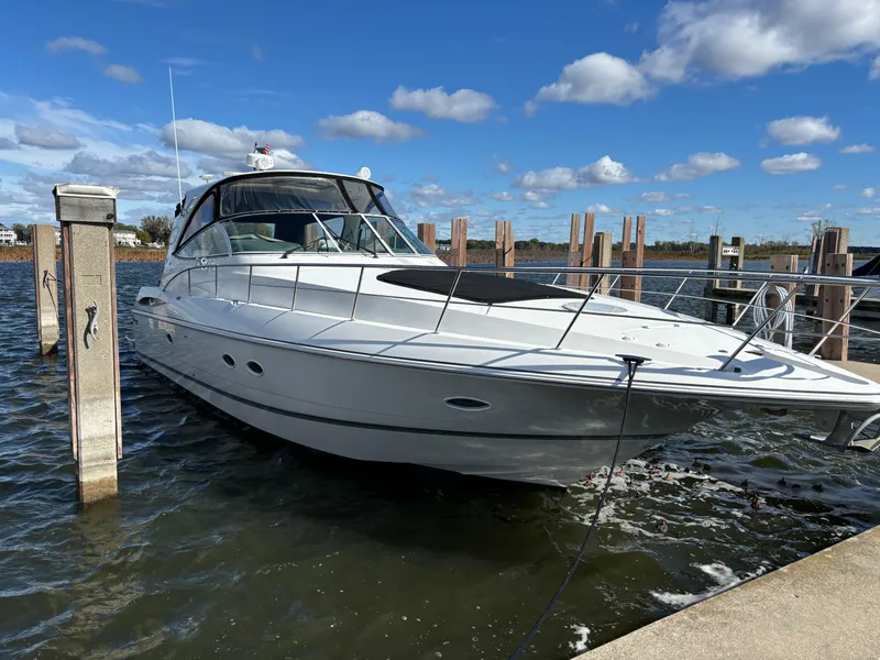 Slide: The Image of 2005 Cruisers Yachts 440 Express docked on a sunny day. - 0