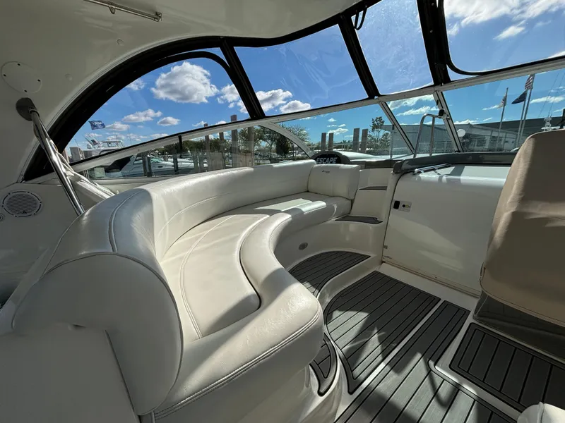 Slide: The Image of Luxurious 2005 Cruisers Yachts 440 Express interior with plush seating and panoramic windows. - 11