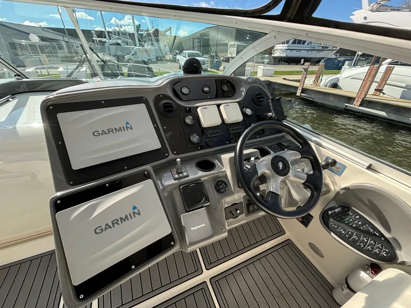 Slide: The Image of Helm of 2005 Cruisers Yachts 440 Express with Garmin navigation displays. - 15